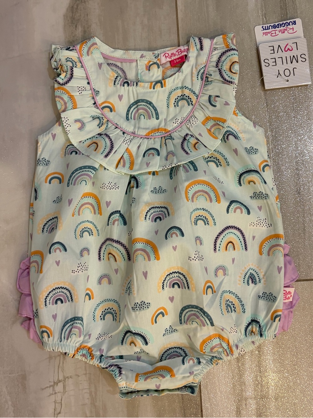 NWT RuffleButts Pastel Cotton Chasing Rainbow Ruffled Bubble Romper Girls 3-6M